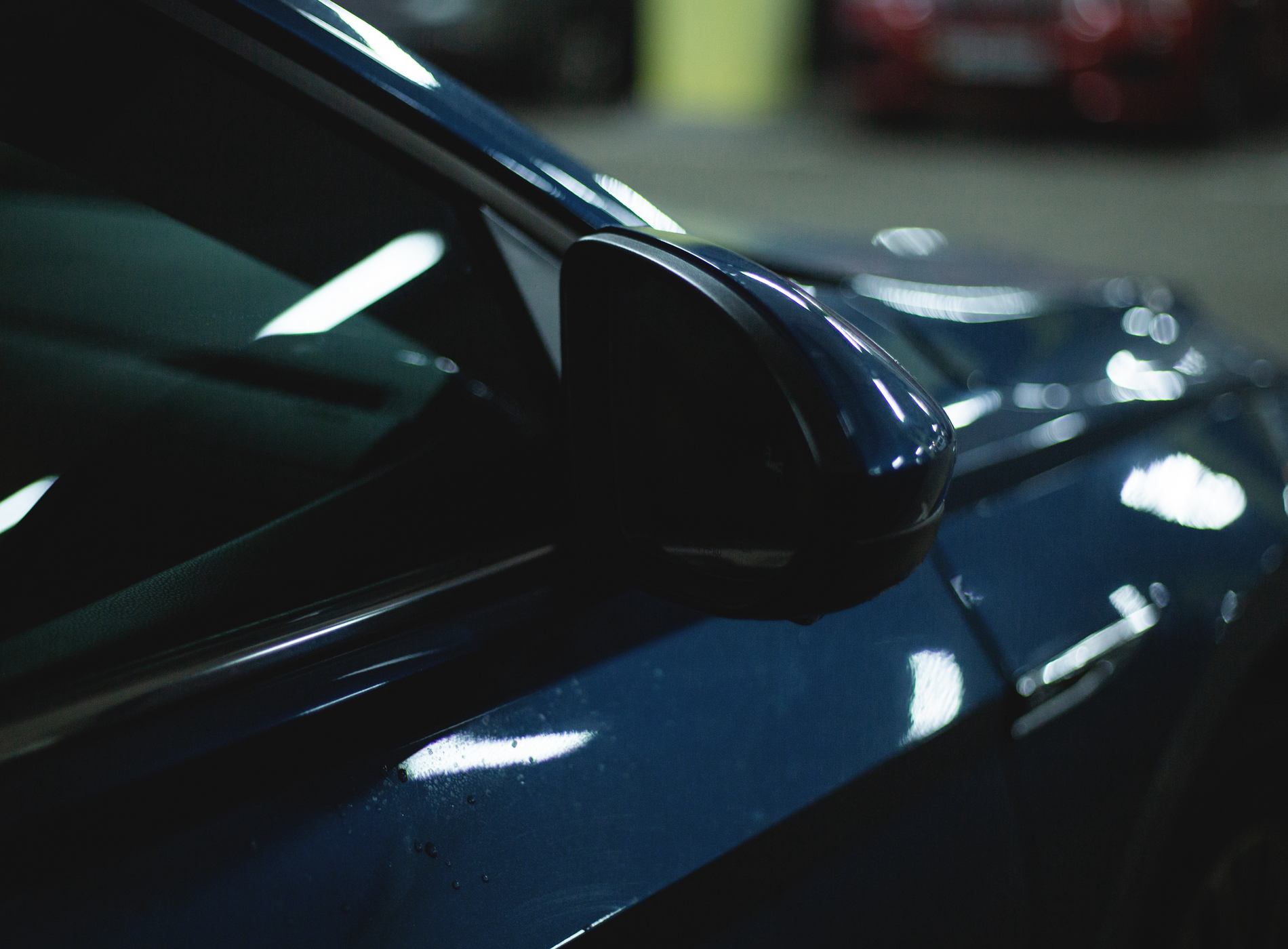 fragment of the front of a modern blue car