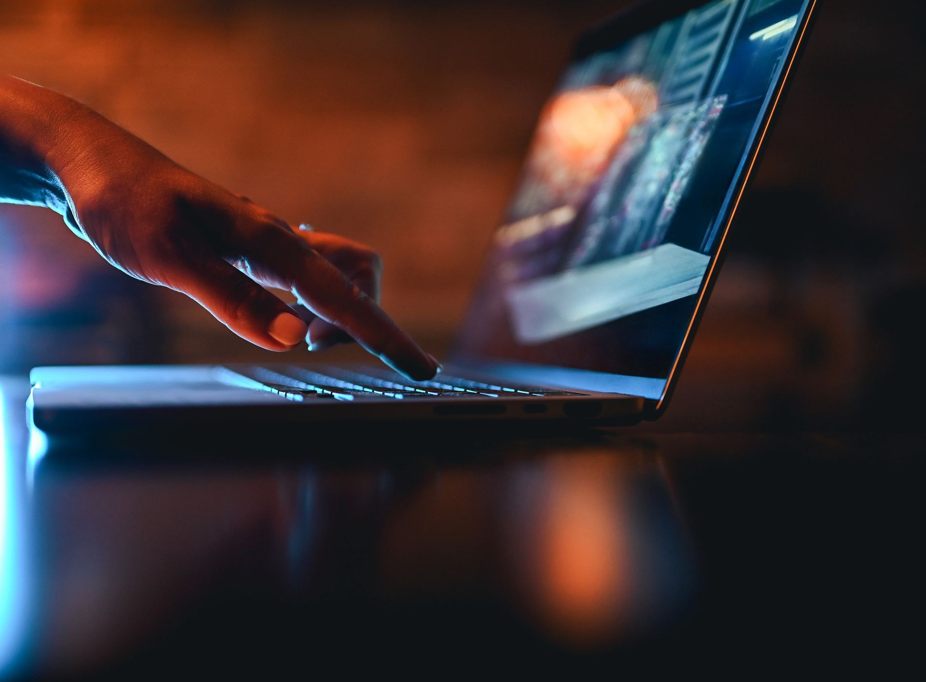 hand typing on computer keyboard