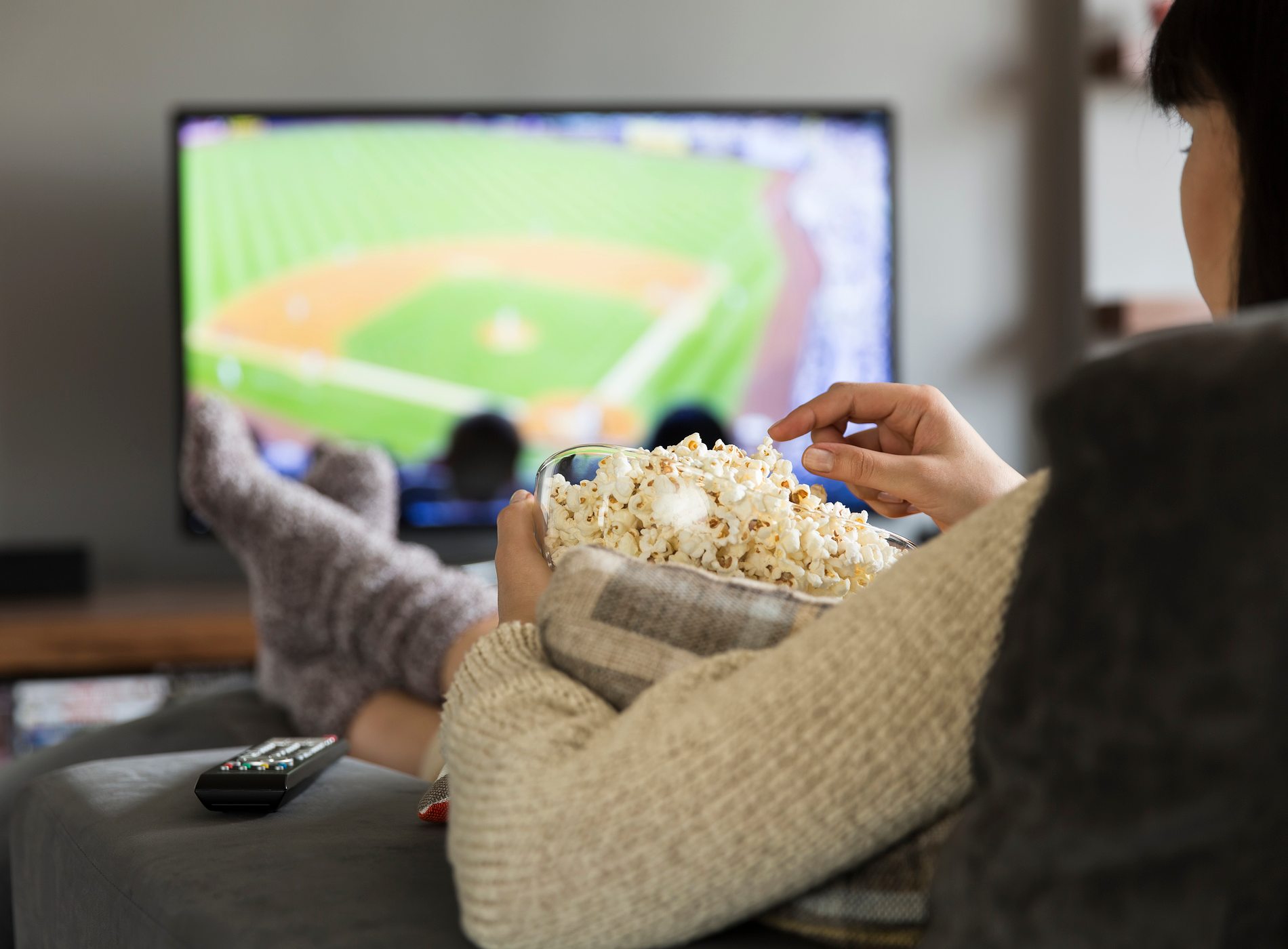 Woman watching baseball