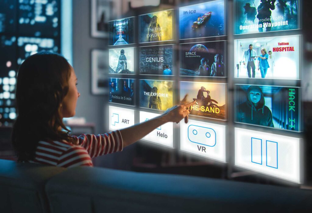 Beautiful Young Woman is Sitting on a Couch at Night at Home and Choosing a Movie to Watch on a Futuristic Augmented Reality Hologram Screen. Futuristic Concept.